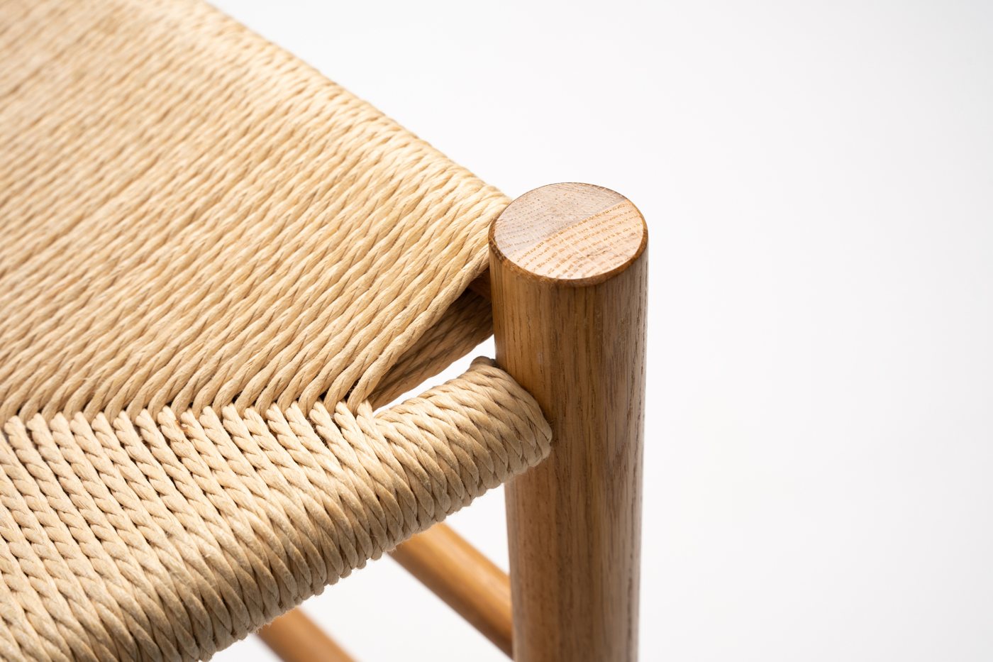 Hand-woven cord seat on a solid timber frame