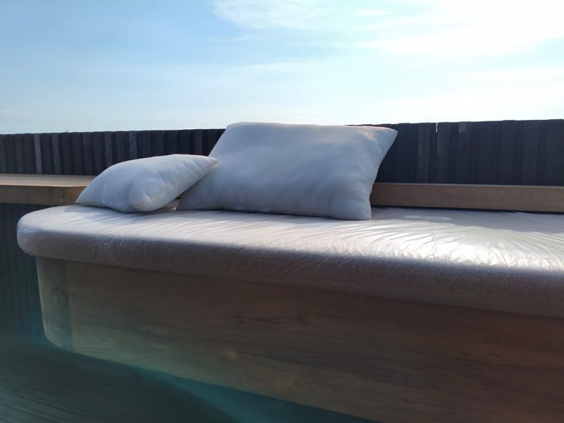 Timber daybed with upholstered cushion