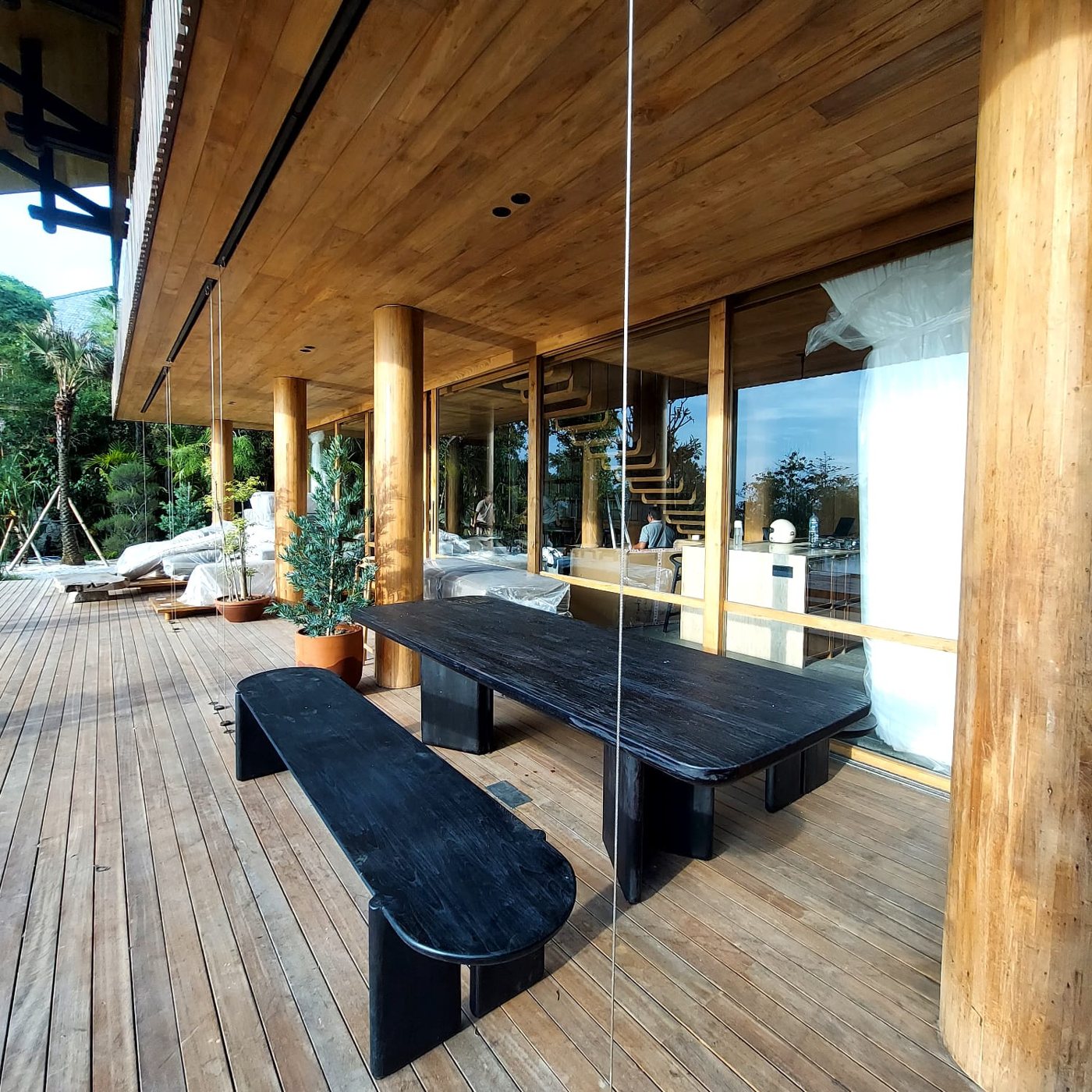 Outdoor dining table and benches on the deck
