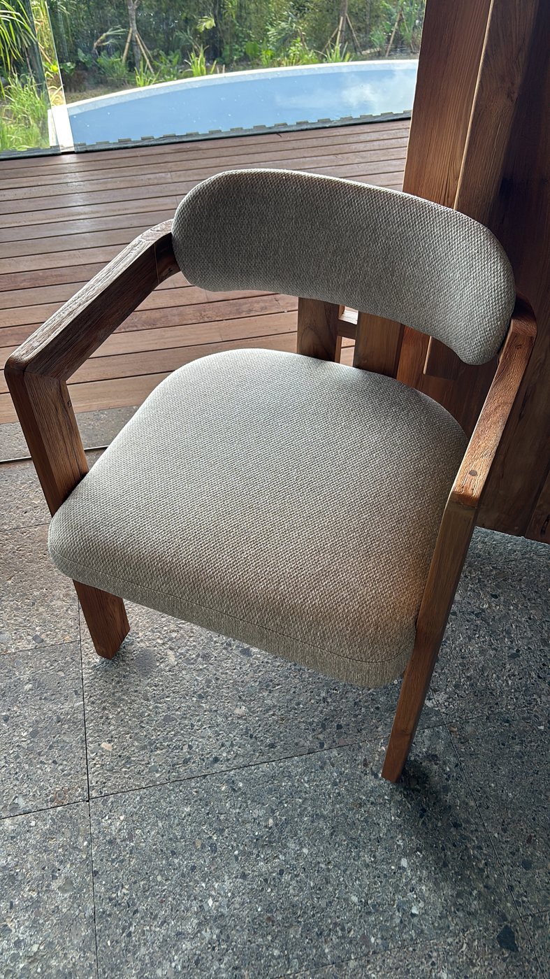 Upholstered armchair with curved timber back